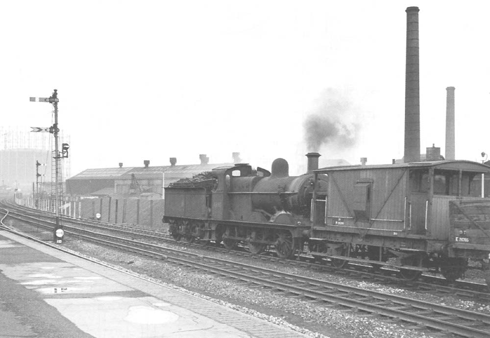 Ex-MR 3F 0-6-0 No 43693 is banking the freight train headed by ex-LMS 0-6-0 No 44659 bound for Bordesley Junction