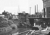 View of the Worcester - Birmingham Canal being drained adjacent to Bristol Road bridge during May 1955