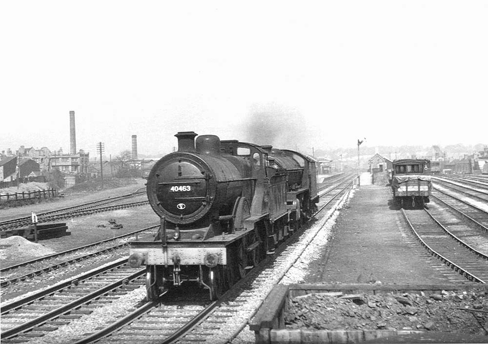 Ex-LMS 4-4-0 2P No 40463 is seen piloting ex-LNER 4-6-0 B1 No 61195 light engine on 19th April 1954