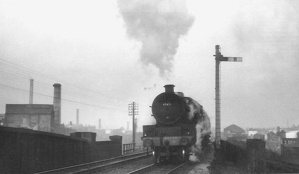 Ex-LMS 4-6-0 Jubilee Class No 45651 'Shovell' stands at Selly Oak station's down advanced starter signal
