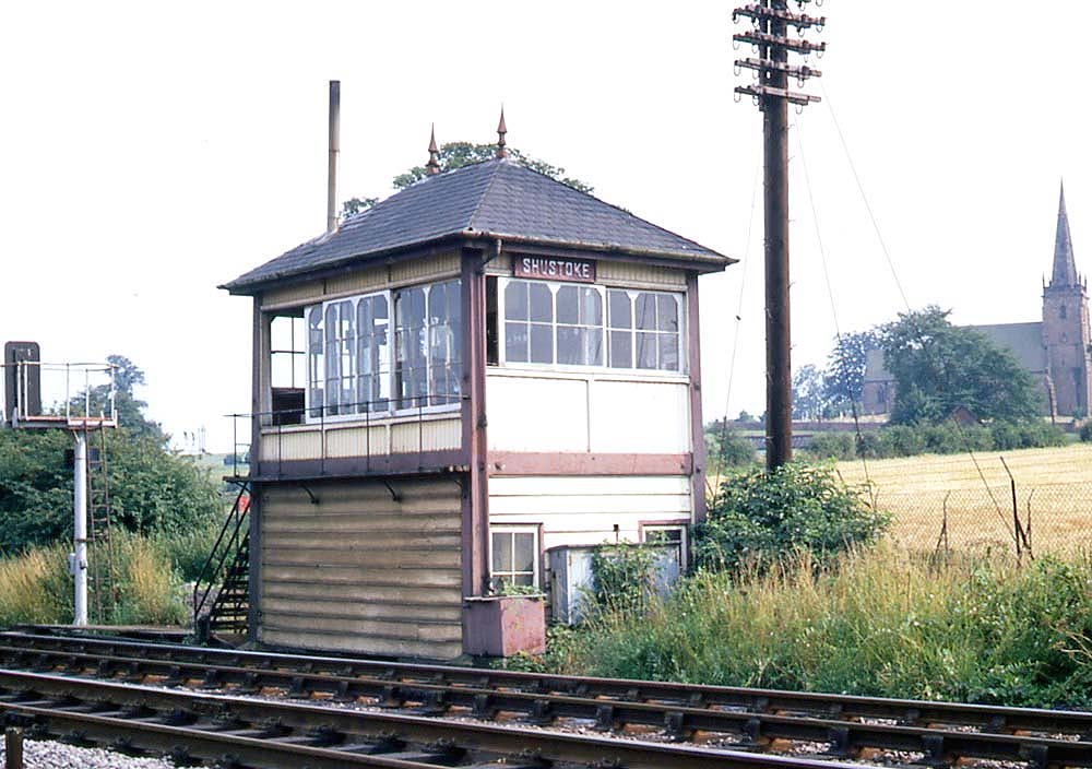 View of Shustoke Signal Box standing adjacent to the up line on 9th August 1969 a few weeks prior to closure