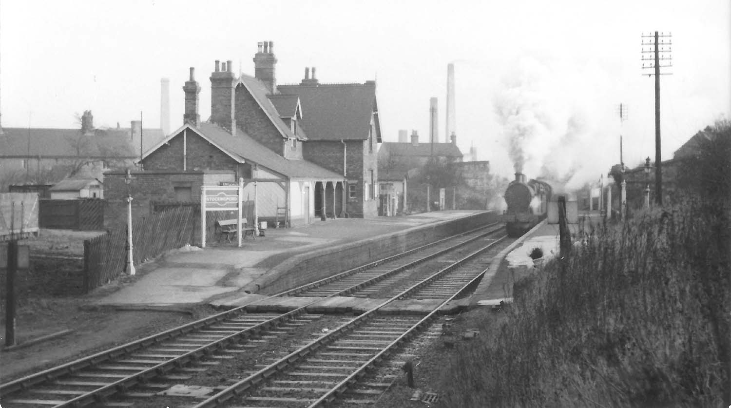 An unidentified ex-Midland Railway 3F 0-6-0 locomotive is piloting an unknown locomotive at the head of a down coal train circa 1955