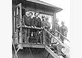 Non-striking railway staff pose with soldiers of the 1st Dorset Regiment outside Stockingford Sidings Signal Box in 1911