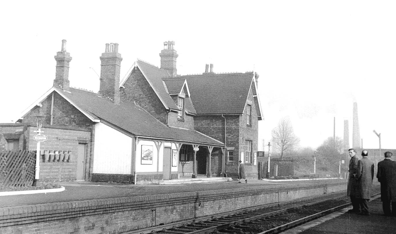 Looking towards Nuneaton Abbey Street with passengers waiting for a Birmingham bound train