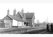 Looking towards Nuneaton Abbey Street with passengers waiting for a Birmingham bound train