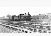 An unidentified ex-MR 0-6-0 locomotive heads a coal train on the steeply graded Stockingford branch