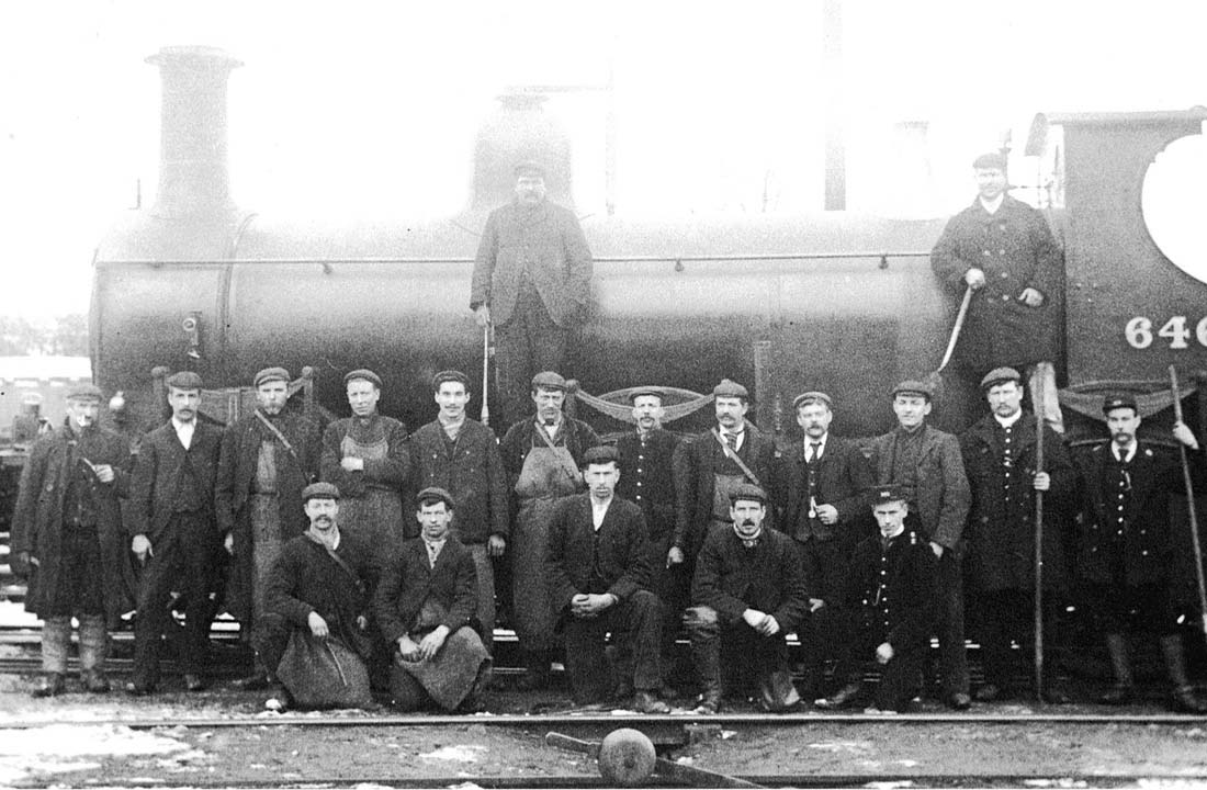 MR 0-6-0 No 646, a member of the 700 Class wearing its pre-1907 number, forms the background to a group photograph