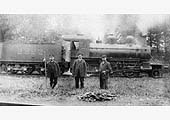 MR 2-6-0 No 2222 presents a backdrop to its crew and shunter (with pole) enjoying a break for their photograph