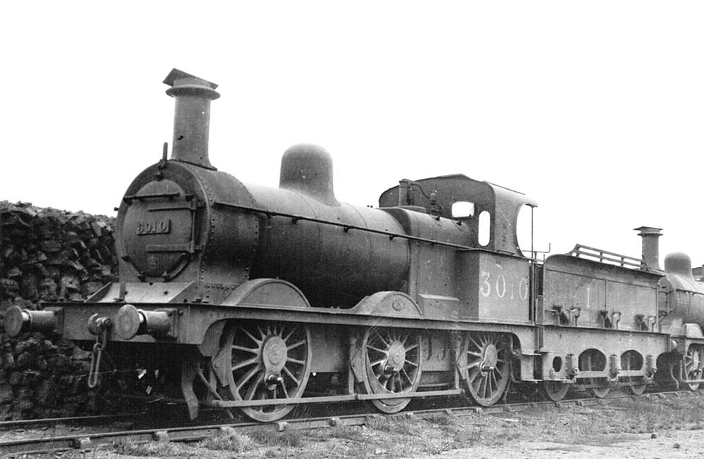 Ex-MR 2F 0-6-0 No 3010 stands in store alongside Stockingford shed's coal stock in the late 1920s