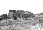 An external view of the Stockingford's abandoned shed with doors rotten and open and all lines removed
