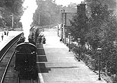 Close up showing the unidentified MR tank engine at the head of a rake of clerestory coaching stock