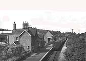 Looking along the  length of Studley and Astwood station as a train for Redditch departs on 21st July 1952