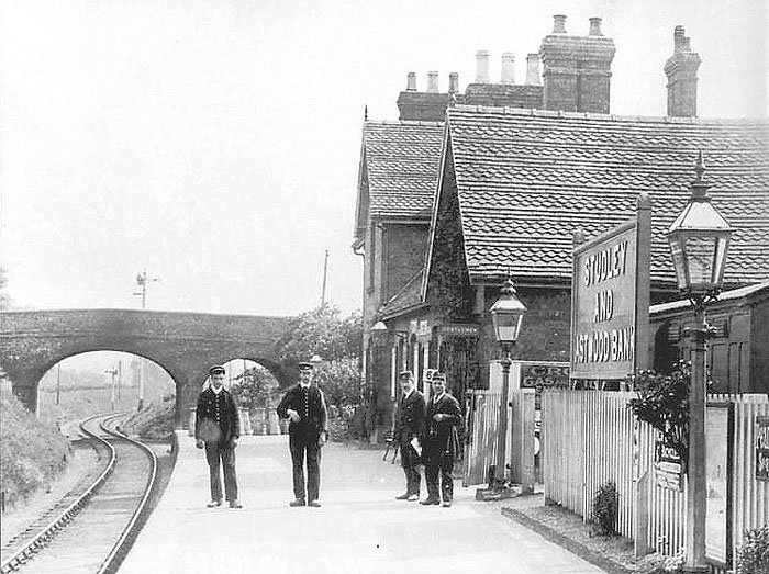 Looking towards Alcester whilst the station's staff pose for the camera at Studley station circa 1900s