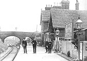 Looking towards Alcester whilst the station's staff pose for the camera at Studley station circa 1900s