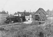 Ex-LMS Stanier 8F 2-8-0 No 48700 passes Studley & Astwood Bank station on a northbound stopping train