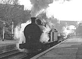 Ex-LNWR 0-8-0 No 49381 runs through the up platform after passing under Anchorage Road bridge on 7th March 1964