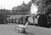 Close up showing ex-LMS 4MT 2-6-4T No 42448 running bunker first on a train to New Street station