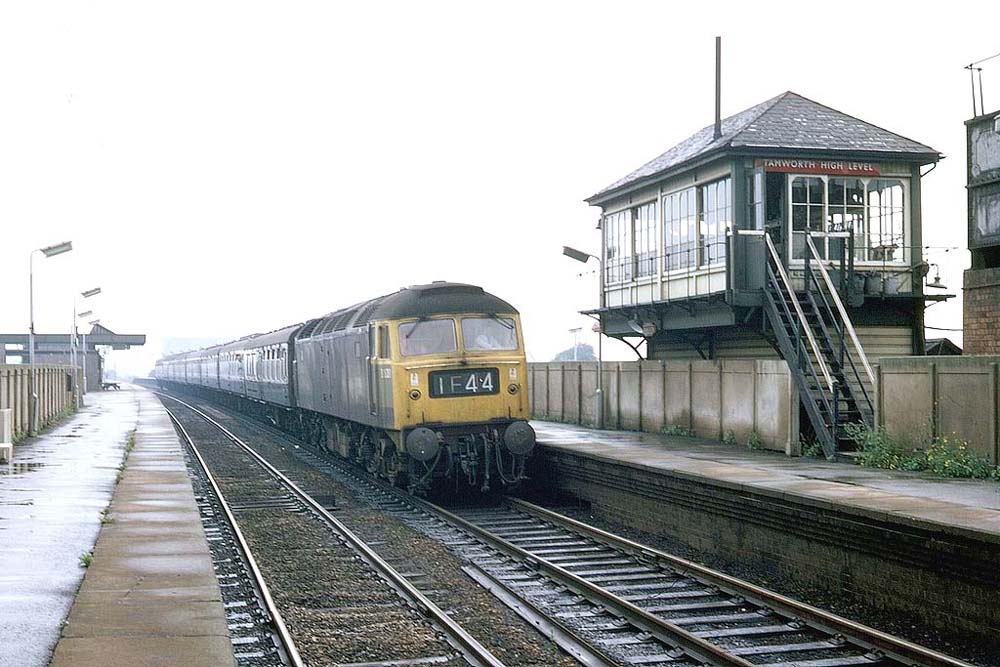 British Railways Type 4 Co-Co D1938 locomotive at the head of an up express service passes through Tamworth's rebuilt High Level station on 9th August 1969