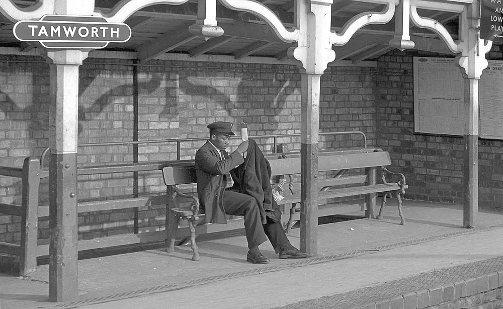 One of Tamworth High Level Station's passengers waits patiently for the next service to Birmingham New Street circa 1960