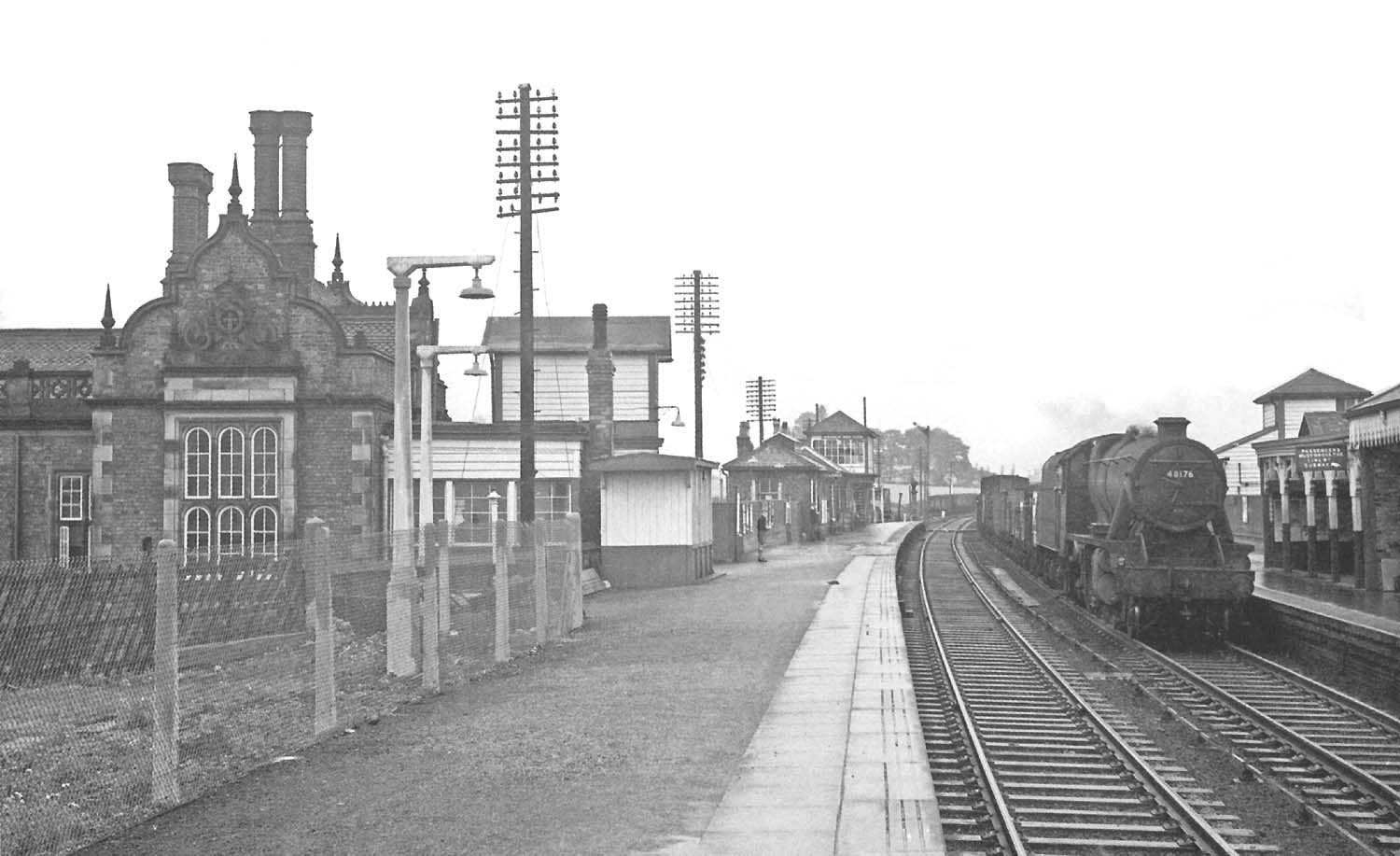 Looking along Tamworth High Level's up platform with the original Livock designed building on the left