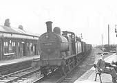 Ex-Midland Railway 3F 0-6-0 No 43294 is on a northbound Class 5 express freight service seen in 1952.