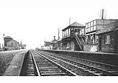 Looking south along the down platform towards Wilnecote with Tamworth High Level Signal Box on the right