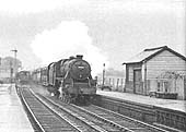 Close up of the unidentified ex-LMS 4-6-0 5MT storming through the station on a down express service