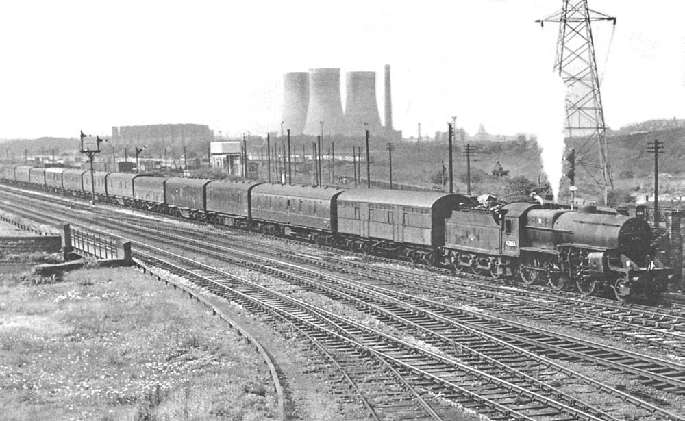 Ex-LMS 2-6-0 'Horwich Crab' No 42855 blows off steam as it heads a parcels train past the exit to Washwood Heath Sidings on 5th September 1962