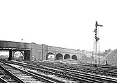 Aston Church Road bridge in the foreground and the bank sidings to the left and right of the signal