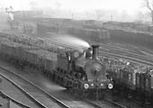 Close up of an unidentified Midland Railway Class 480 locomotive is seen reversing  a train of coal wagons along Washwood Heath's No 3 Arrival Road