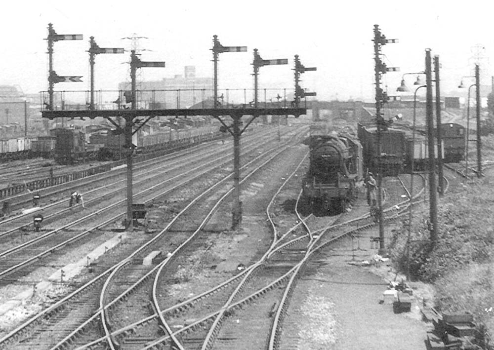 Close up showing an unidentified ex-LMS 2-8-0 8F locomotive ready to take forward a coal train to Bordesley sidings