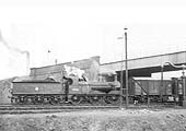 Ex-Midland Railway 0-6-0 2F No 58261 is seen passing under the ex-LNWR bridge whilst shunting at the West end of Washwood Heath's down sidings