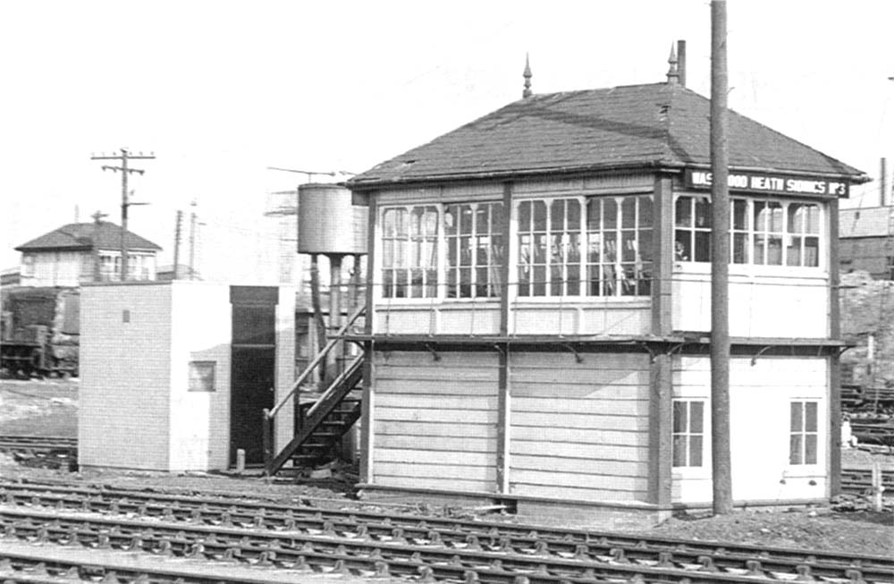 View of Washwood Heath Sidings No 3 Signal Box with No 4 signal box seen behind and the parachute water tower standing between the two