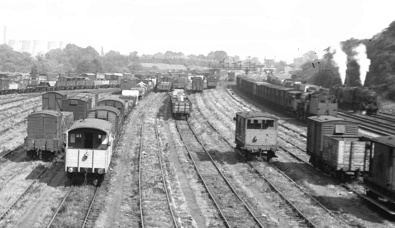 Close up showing on the right a number of ex-LMS locomotives, a 2-6-0 'Horwich Crab' and , as a double header, a 4-6-0 Stanier Black 5 piloting an 0-6-0 4F 'Big Goods
