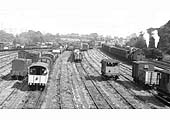 Close up of a 2-6-0 'Horwich Crab', and a 4-6-0 Stanier Black 5 locomotive piloting a 'Midland' 0-6-0 4F 'Big Goods