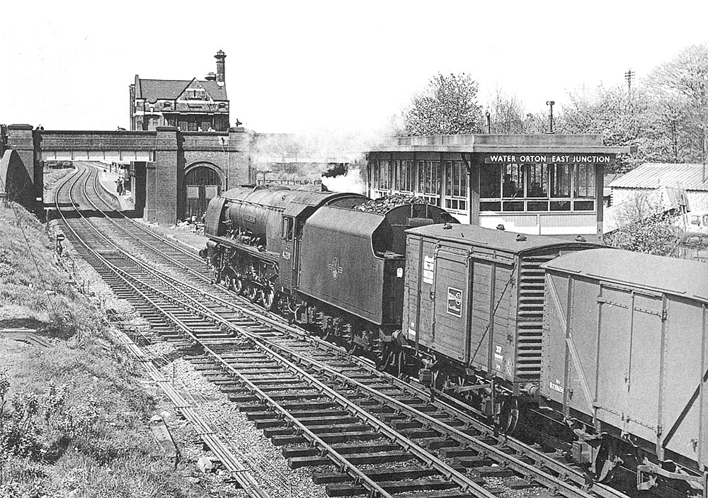 Ex-LMS 8P 4-6-2 No 46239 'City of Chester' passes Water Orton's replacement signal whilst at the head of a parcels service from Leicester on 3rd May 1964