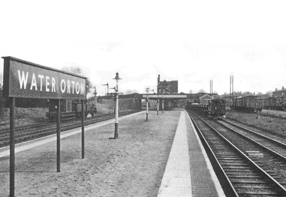 View along the island platform of Water Orton's second station with the  up passenger line on the left and the down line on the right