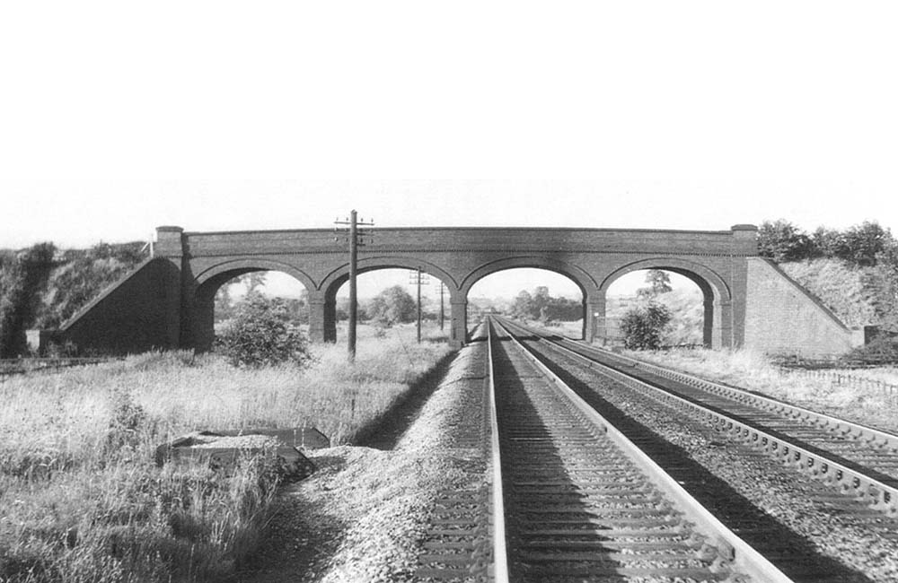 View of the bridge carrying Birmingham Road over the railway near Lea Marston on 30th June 1959