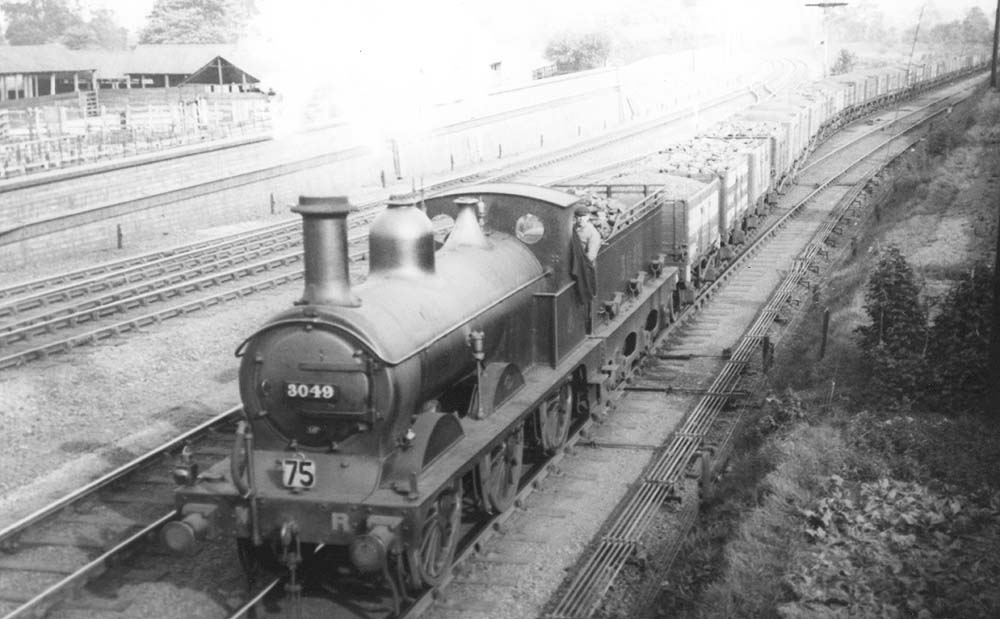 Water Orton Station Midland Railway 060 2F No 3049 is seen passing