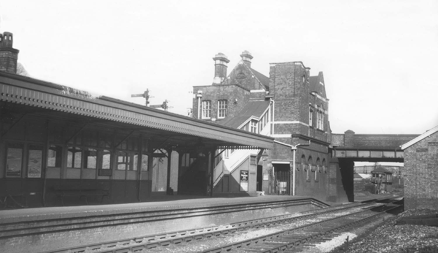 View from the goods yard towards the 'down' face of Water Orton's island platform with the MR signal box seen through the bridge