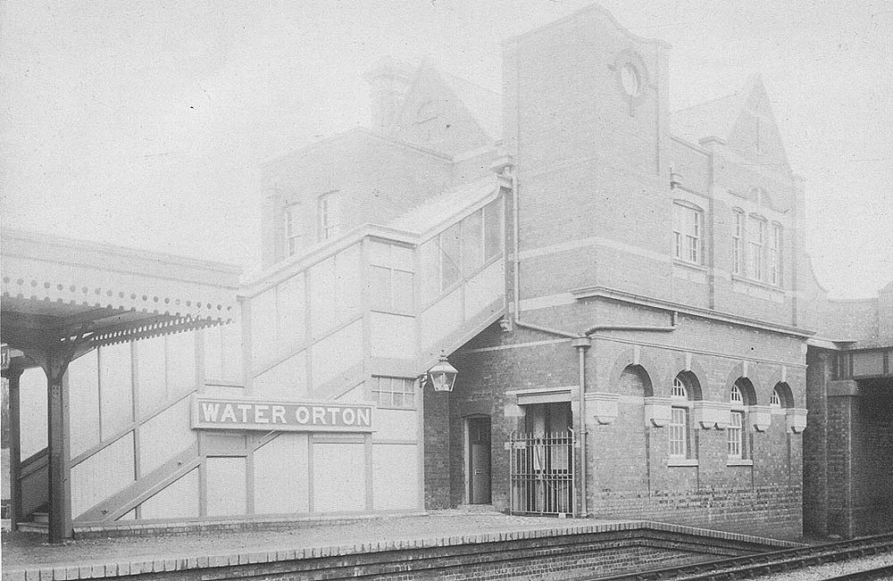  A 1908 view of the two storey brick built main station building and the wooden covered stairway leading down from the booking hall