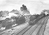 Ex-LMS 8F 2-8-0 No 48247 passes British Railways Standard Class 4 2-6-0 No 76086 at Water Orton junction on 21st May 1966