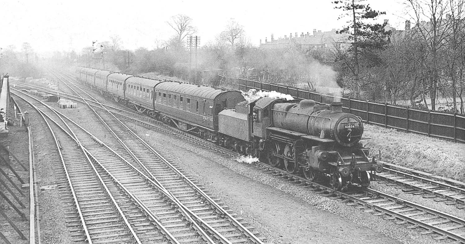 British Railways built 'Ivatt' 4MT 2-6-0 No 43036 enters Water Orton with a Class A express service on 28th February 1959