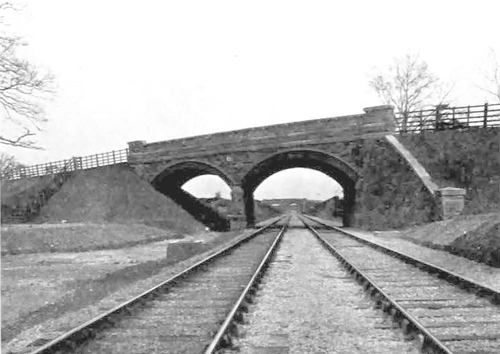 Looking north through the arches of the ornamental stone road bridge crossing cutting No 1, on Lord Norton's property