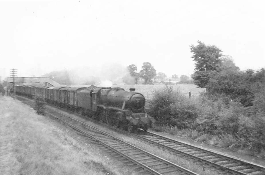 An unidentified ex-LMS 5MT 4-6-0 locomotive is seen proceeding with a Class C service on the down line from Kingsbury to Water Orton