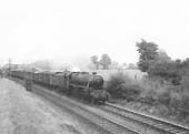 An unidentified ex-LMS 5MT 4-6-0 locomotive is seen proceeding with a Class C service on the down line from Kingsbury to Water Orton