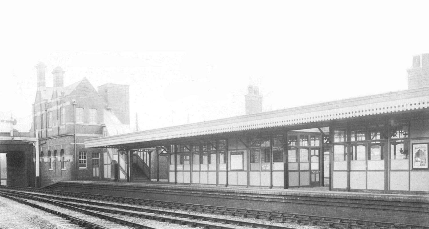 A lineside view of the up platform and the pair of amply glazed timber buildings which stood on the platform