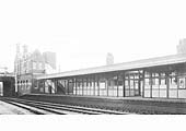 A lineside view of the up platform and the pair of amply glazed timber buildings which stood on the platform