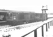 Two unidentified English Electric Type 1 locomotives pass through Water Orton station towards Derby on a very wintry day