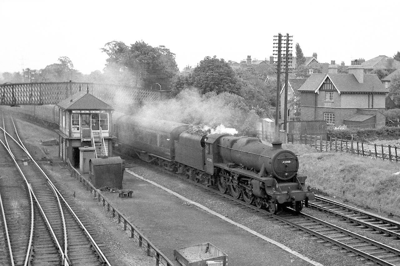 Ex-LMS 5MT 4-6-0 No 45088 passes the 1909 Midland Railway Signal Box with a Class A Derby to Birmingham express service circa 1959